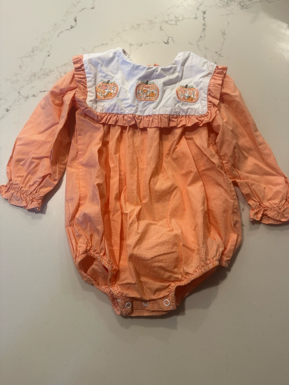 Orange Pumpkin Bubble Romper with White Yoke. 18 months